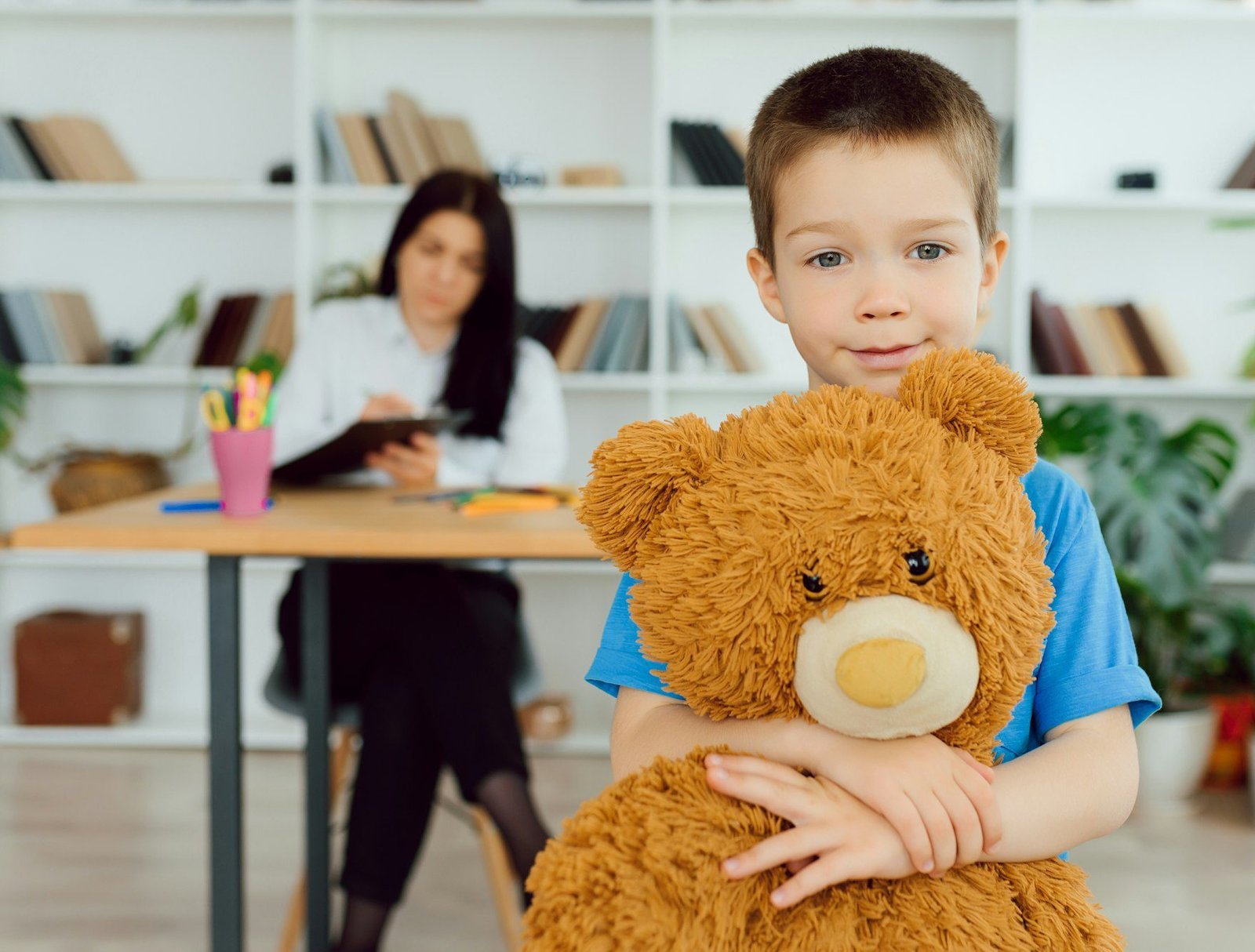 The concept of child psychology. A boy at the psychologist